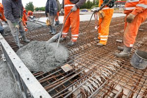 Concrete pourers on a construction site in high vis gear