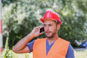 frustrated construction worker on the phone