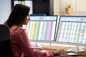 construction administrator looking at a spreadsheet