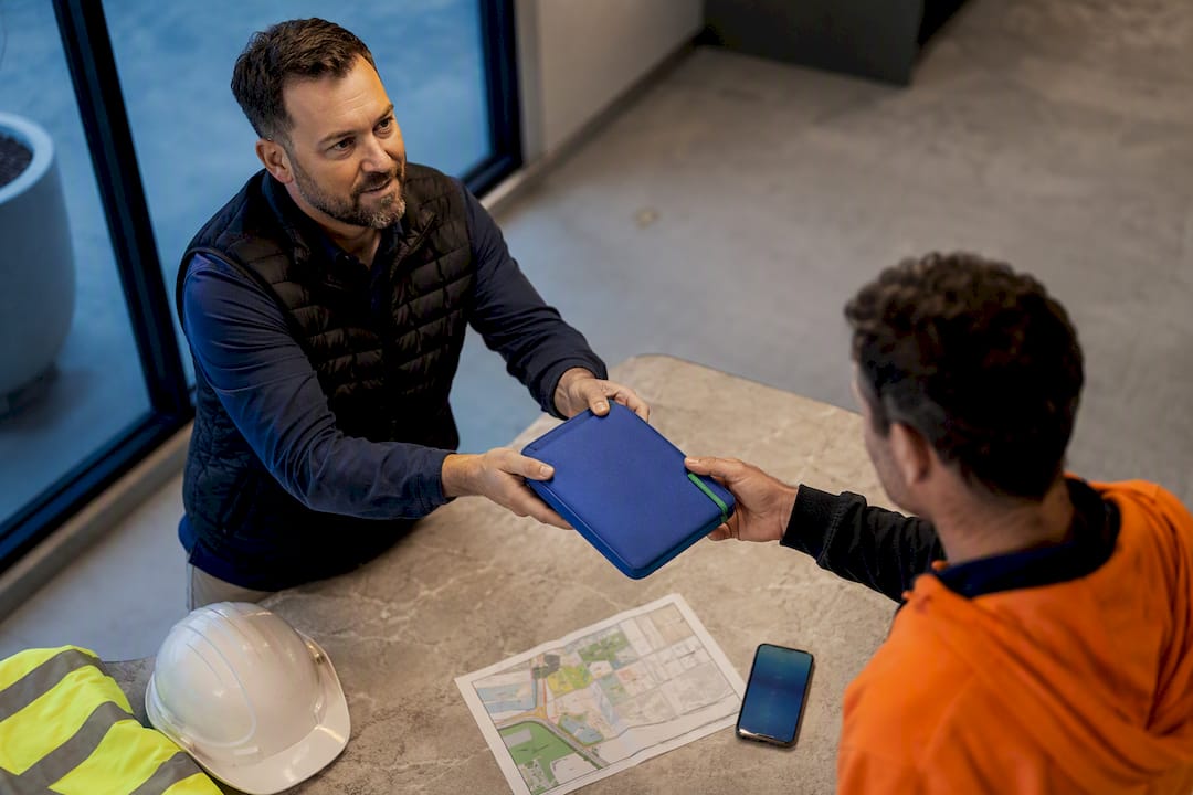 Worker receiving labour hire arrival pack