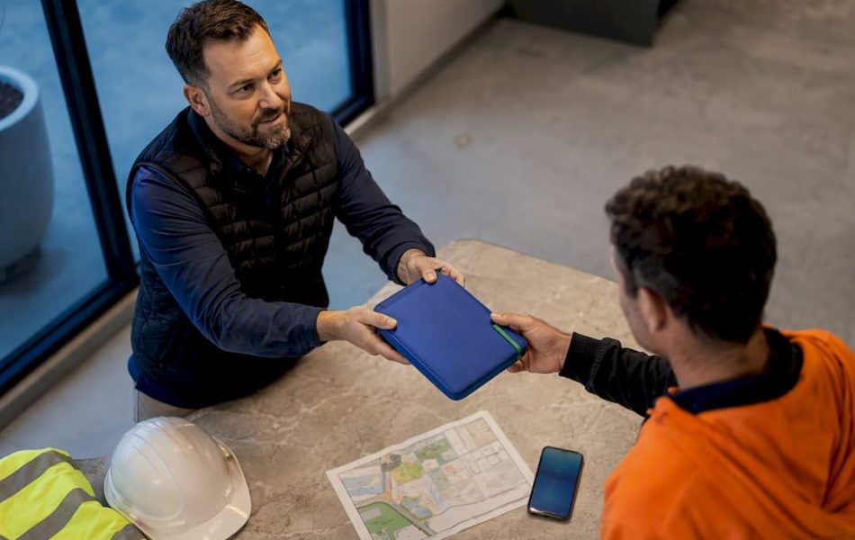 Worker receiving labour hire arrival pack