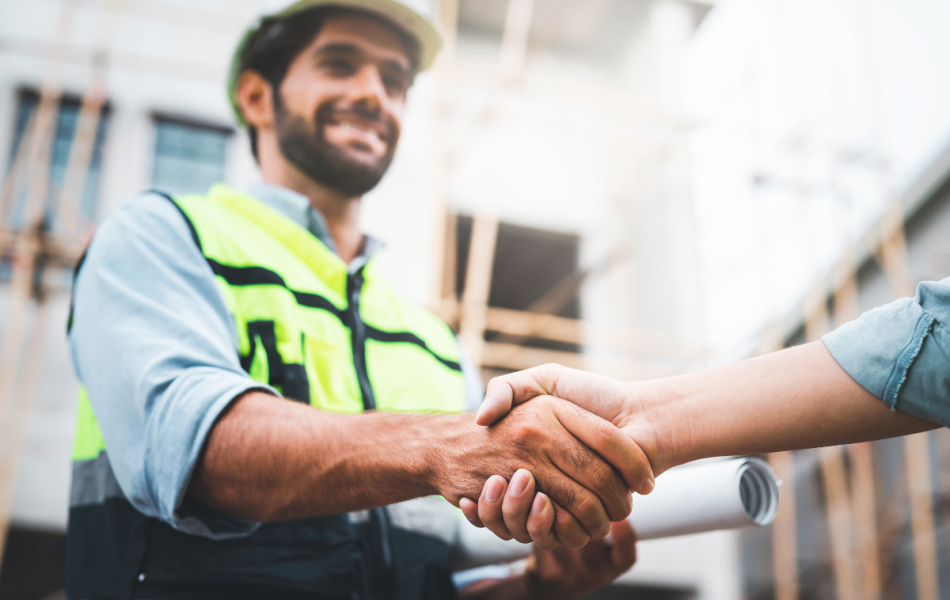 trade business owner shaking hands after winning a tender