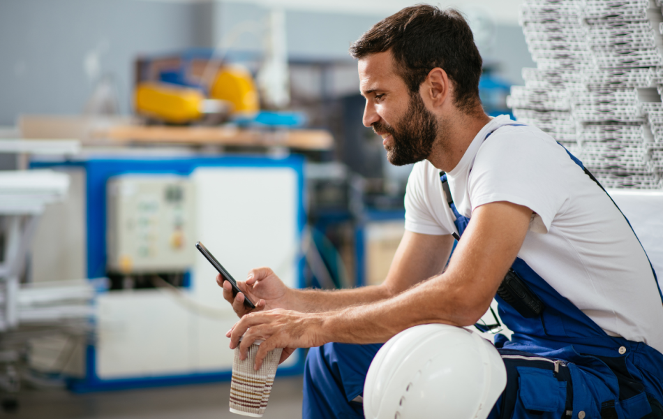 construction worker looking at his phone