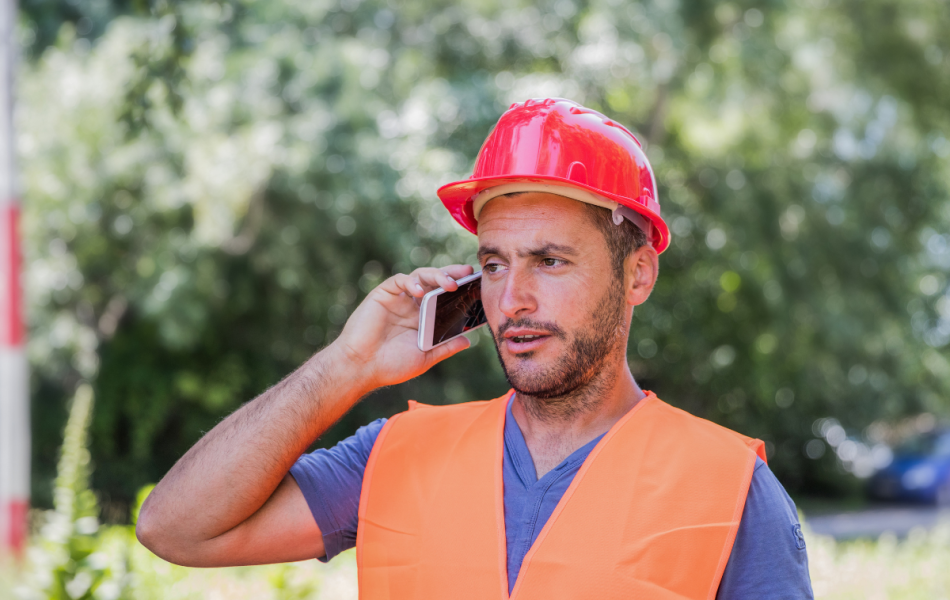 frustrated construction worker on the phone