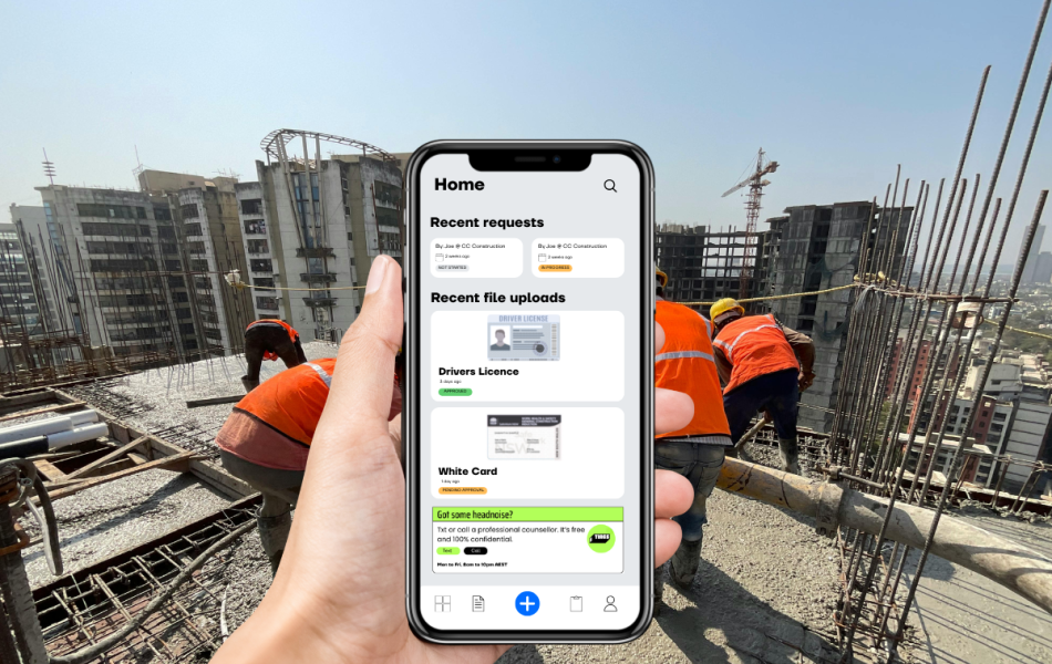 tradies on a construction site with a hand holding a phone viewing the tradie pass app