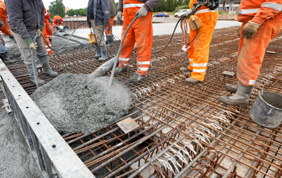 Concrete pourers on a construction site in high vis gear